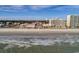 Aerial view of beach, ocean, and nearby buildings at 1245 Lady Bird Way, North Myrtle Beach, SC 29582