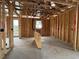 Interior framing of a room showing the studs, electrical wiring, window, and exterior door at 1245 Lady Bird Way, North Myrtle Beach, SC 29582