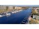 Aerial view of a marina with boats docked in the water, complemented by an American flag waving in the breeze at 1245 Lady Bird Way, North Myrtle Beach, SC 29582