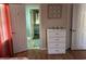 Bedroom with dresser and view into bathroom at 130 Easy St., Murrells Inlet, SC 29576