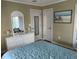 Bedroom with dresser, mirror, and light teal bedding at 130 Easy St., Murrells Inlet, SC 29576