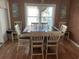 Dining room with wood table and white chairs at 130 Easy St., Murrells Inlet, SC 29576