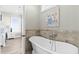 Freestanding bathtub with marble tile surround at 1303 S Ocean Blvd., North Myrtle Beach, SC 29582