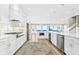 Modern white kitchen with stainless steel appliances at 1303 S Ocean Blvd., North Myrtle Beach, SC 29582