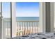 Bedroom with stunning ocean view from private balcony at 1303 S Ocean Blvd., North Myrtle Beach, SC 29582