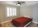 Bedroom with hardwood floors, plantation shutters, and a double bed at 132 Serenity Point Dr., Little River, SC 29566