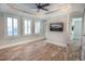 Spacious bedroom with hardwood floors, plantation shutters, and ceiling fan at 132 Serenity Point Dr., Little River, SC 29566