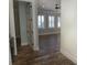 View down hallway showcasing hardwood floors and a door to a room at 132 Serenity Point Dr., Little River, SC 29566