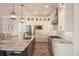 Modern kitchen with granite countertops and white shaker cabinets at 132 Serenity Point Dr., Little River, SC 29566