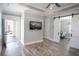 Living room with hardwood floors, sliding barn doors, and access to outdoor space at 132 Serenity Point Dr., Little River, SC 29566