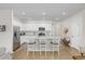 Modern kitchen with white cabinets and granite countertops at 1334 Palm Springs Paloma Dr, Longs, SC 29568