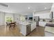 Island kitchen with granite countertops and white cabinets at 1334 Palm Springs Paloma Dr, Longs, SC 29568