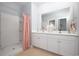 Double vanity bathroom with shower and neutral color scheme at 1349 Palm Springs Paloma Dr, Longs, SC 29568