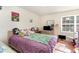 Bright bedroom with a double bed, TV, and lots of stuffed animals at 1350 Mcmaster Dr. # C, Myrtle Beach, SC 29575