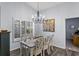 Bright dining room with farmhouse table and chandelier at 1420 Jardine Loop, Little River, SC 29566