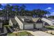 Two-story home with gray siding, two car garage and landscaping at 1420 Jardine Loop, Little River, SC 29566