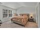 Bright bedroom with large window, plush bedding, and ample floor space at 1454 Jardine Loop, Little River, SC 29566