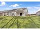 Rear exterior view of home showcasing patio and yard at 1454 Jardine Loop, Little River, SC 29566