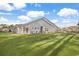 Rear exterior of house with patio and grassy yard at 1454 Jardine Loop, Little River, SC 29566