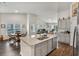 Modern kitchen with granite countertops, gray cabinets, and a large island with a double sink at 1454 Jardine Loop, Little River, SC 29566