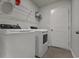 Laundry room with washer, dryer, and overhead shelving at 1454 Jardine Loop, Little River, SC 29566