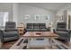 Relaxing living room featuring a neutral color palette, plush seating, and a large coffee table at 1454 Jardine Loop, Little River, SC 29566