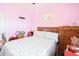 Bedroom with pink walls, starfish bedding, and a wooden dresser at 149 Westhaven Dr. # B13, Myrtle Beach, SC 29579