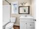 Clean bathroom, featuring a white vanity and stained glass window at 1553 Landing Rd., Myrtle Beach, SC 29577