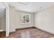 Bright bedroom with wood-look floors and large window at 1553 Landing Rd., Myrtle Beach, SC 29577