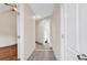 Clean hallway with tile floors leading to the bathroom at 1553 Landing Rd., Myrtle Beach, SC 29577