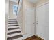 Modern staircase with dark brown wooden steps and white risers at 1553 Landing Rd., Myrtle Beach, SC 29577