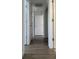 Long hallway with light walls and wood-look flooring at 1674 Citadel Ln., Myrtle Beach, SC 29577