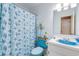 Charming bathroom with a blue sink and seashell shower curtain at 1751 Gibson Ave., Surfside Beach, SC 29575