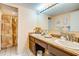 Well-lit bathroom with double sinks, granite countertops, and a shower at 1751 Gibson Ave., Surfside Beach, SC 29575