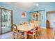 Bright dining room with a wood table and chairs, view into sunroom at 1751 Gibson Ave., Surfside Beach, SC 29575