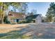 Landscaped yard surrounds this charming house with stone accents and a large garage at 1751 Gibson Ave., Surfside Beach, SC 29575