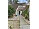 Welcoming front entrance with stone pathway and landscaping at 1751 Gibson Ave., Surfside Beach, SC 29575