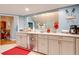 Bright kitchen with white cabinets and a view into the dining area at 1751 Gibson Ave., Surfside Beach, SC 29575