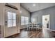 Bright dining area with hardwood floors and a view into a living room at 1811 Berkley Village Loop, Myrtle Beach, SC 29579