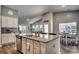 Modern kitchen with granite island, stainless steel appliances, and hardwood floors at 1811 Berkley Village Loop, Myrtle Beach, SC 29579