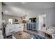 Open living room with hardwood floors, and view of kitchen and dining area at 1811 Berkley Village Loop, Myrtle Beach, SC 29579