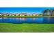 Beautiful pond view with lush greenery and homes in the background at 1811 Berkley Village Loop, Myrtle Beach, SC 29579