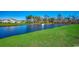 Serene pond view with fountain, lush landscaping and homes at 1811 Berkley Village Loop, Myrtle Beach, SC 29579