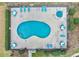 Aerial view of kidney-shaped pool and hot tub at 1851 Colony Dr. # 5E, Surfside Beach, SC 29575