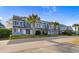 Row of townhouses showcasing a well-maintained exterior at 1851 Colony Dr. # 5E, Surfside Beach, SC 29575