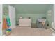 Bedroom with a crib, changing table and seating area at 19 Springfield Rd., Pawleys Island, SC 29585