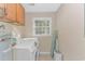 Laundry room with washer, dryer, and cabinets at 19 Springfield Rd., Pawleys Island, SC 29585