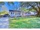 Charming gray house with a spacious yard and a golf cart in the driveway at 1900 Allston St., Georgetown, SC 29440