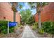 Brick walkway leads to a park with palm trees and benches at 1900 Allston St., Georgetown, SC 29440