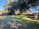 Large backyard with grass, trees, and shed at 1916 Calhoun St., Georgetown, SC 29440